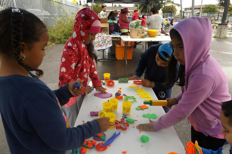 Children playing with modeling clay at a table