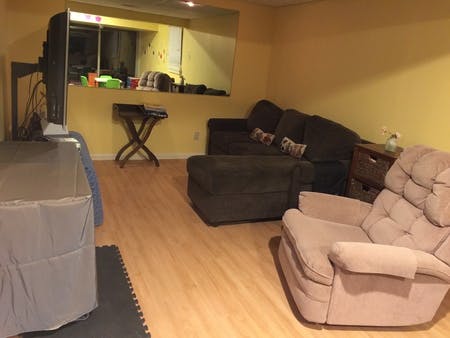 Living room with couches and a recliner
