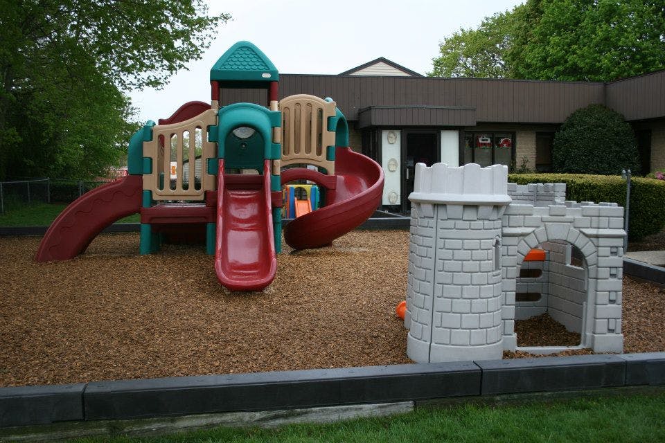 Playground with slides and a small castle structure