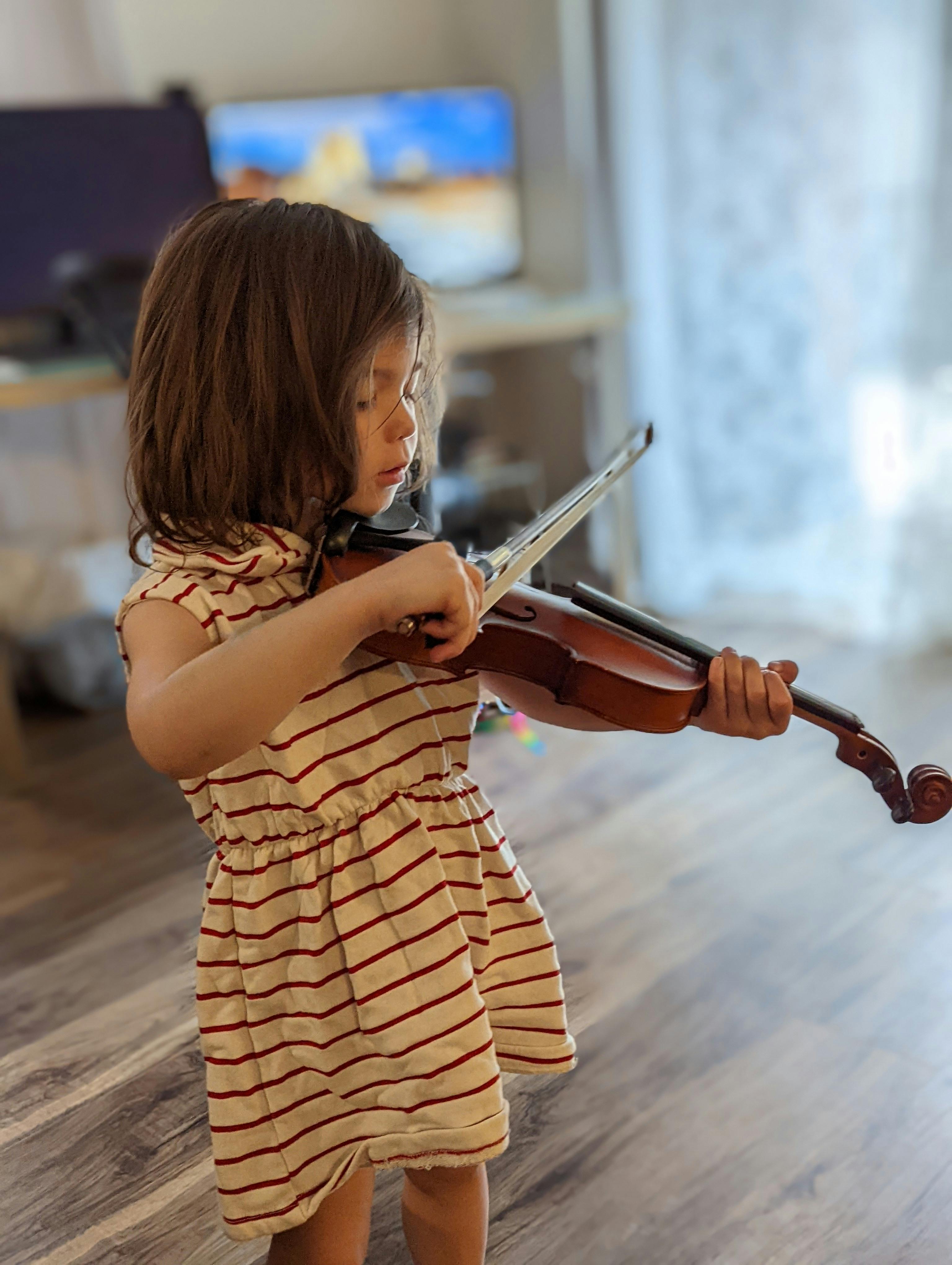 Child playing a violin
