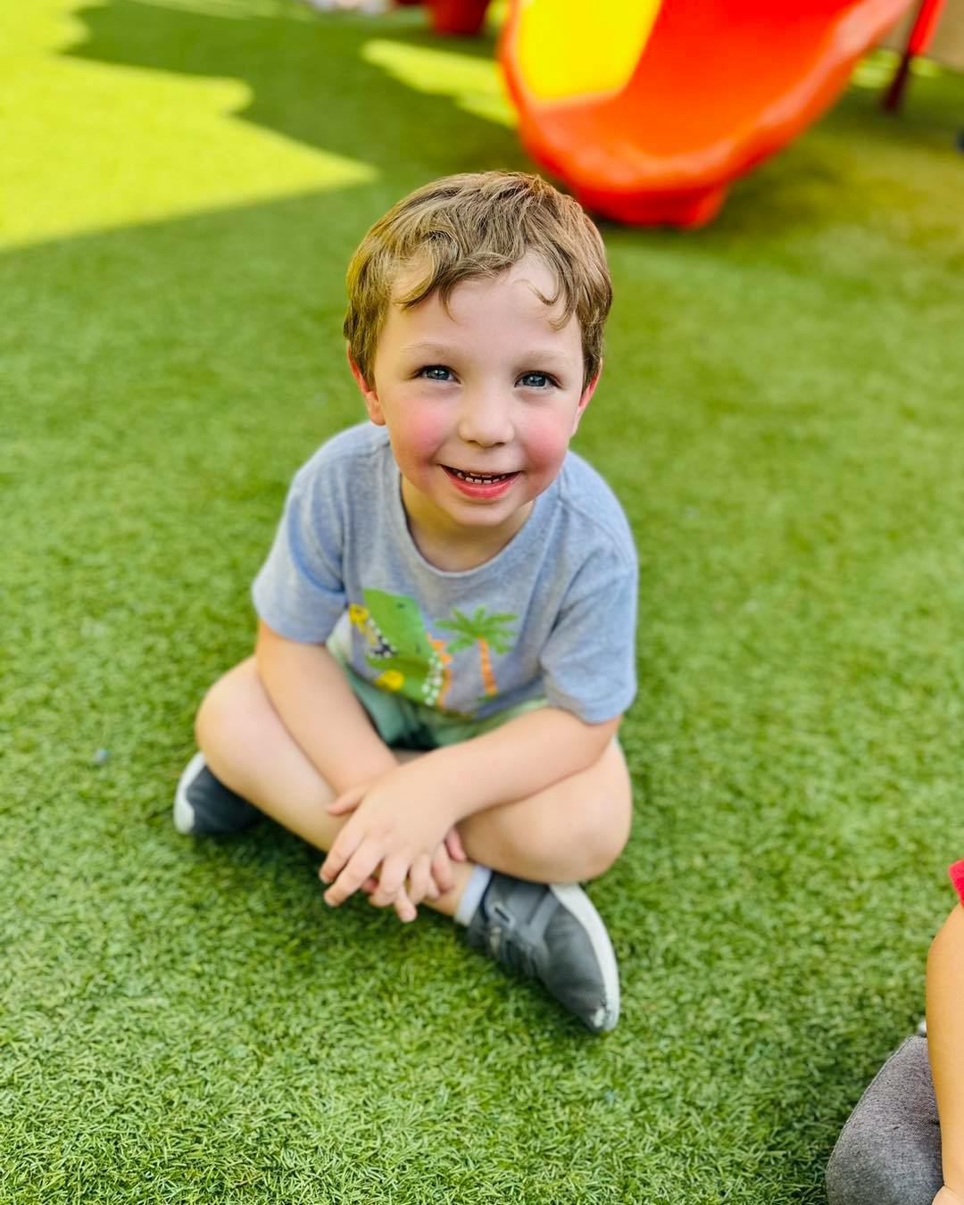 Child sitting on grass