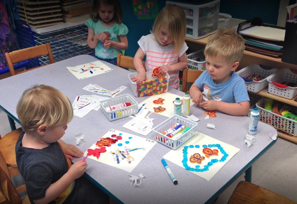 Children doing crafts at a table