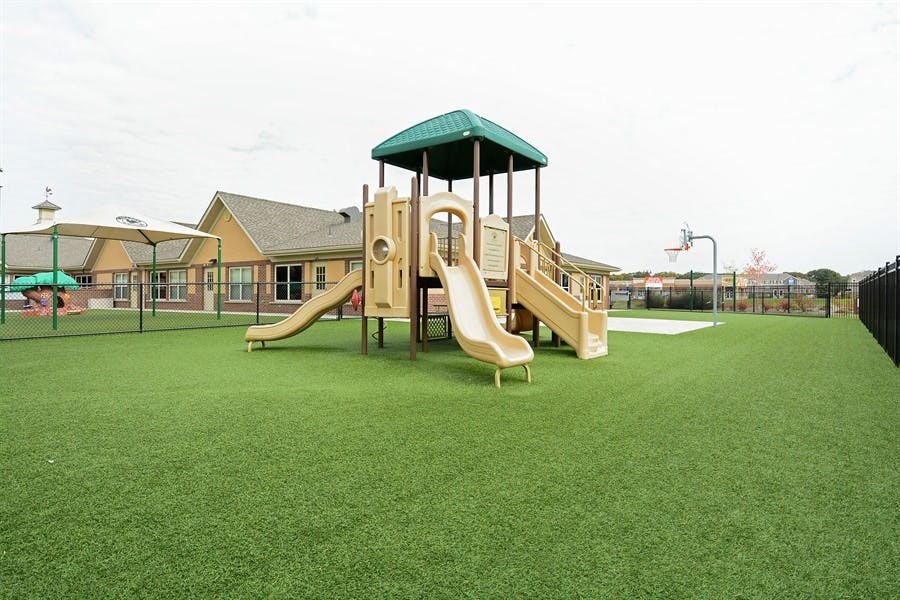 Playground with slides and green turf