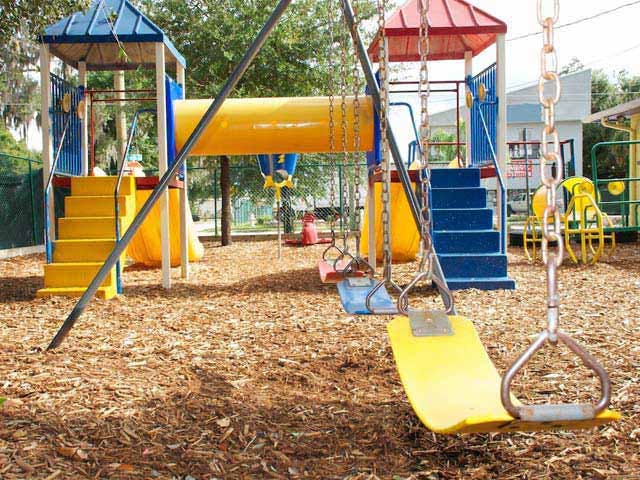 Playground with swings and climbing structure