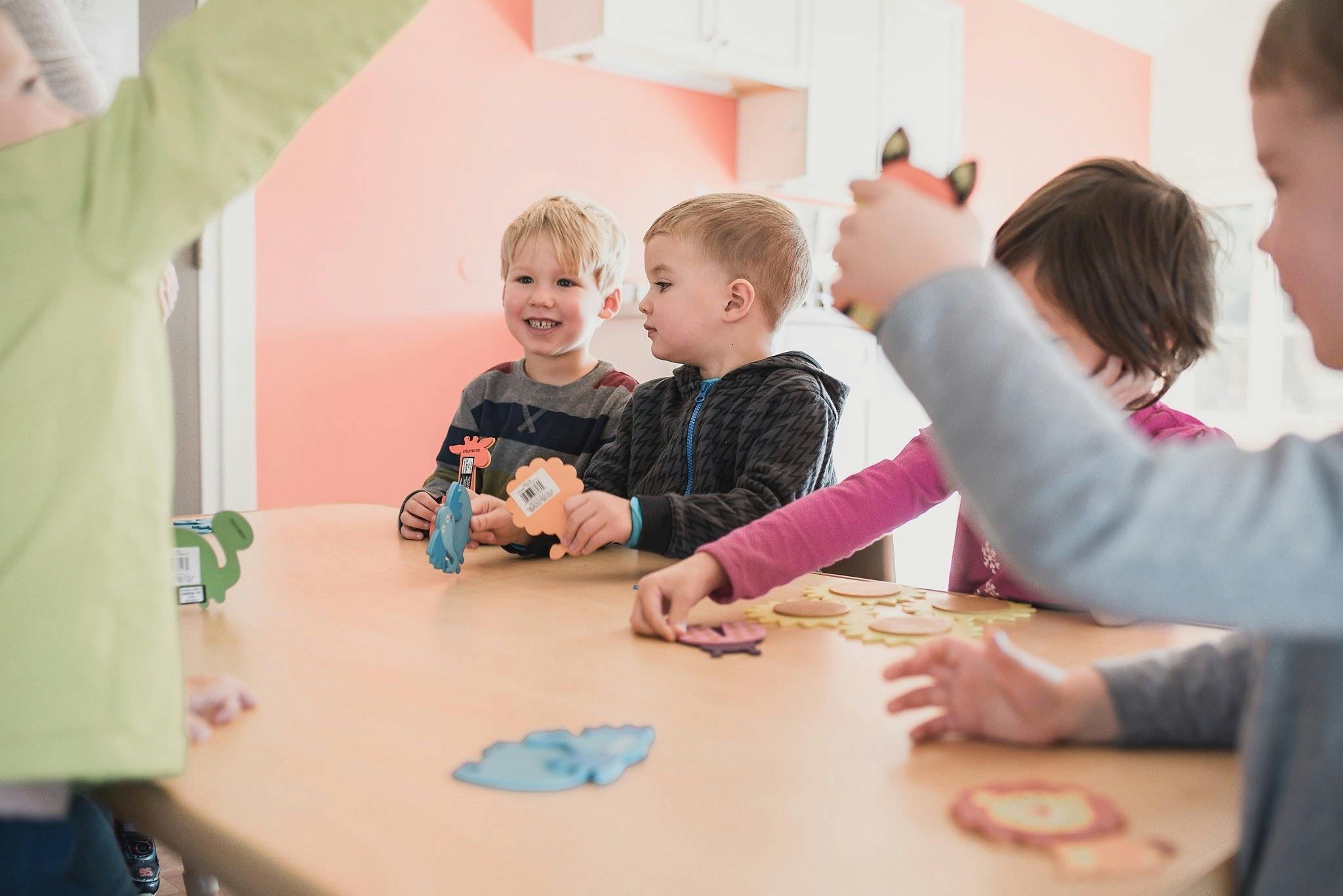 Children playing with toys at a table