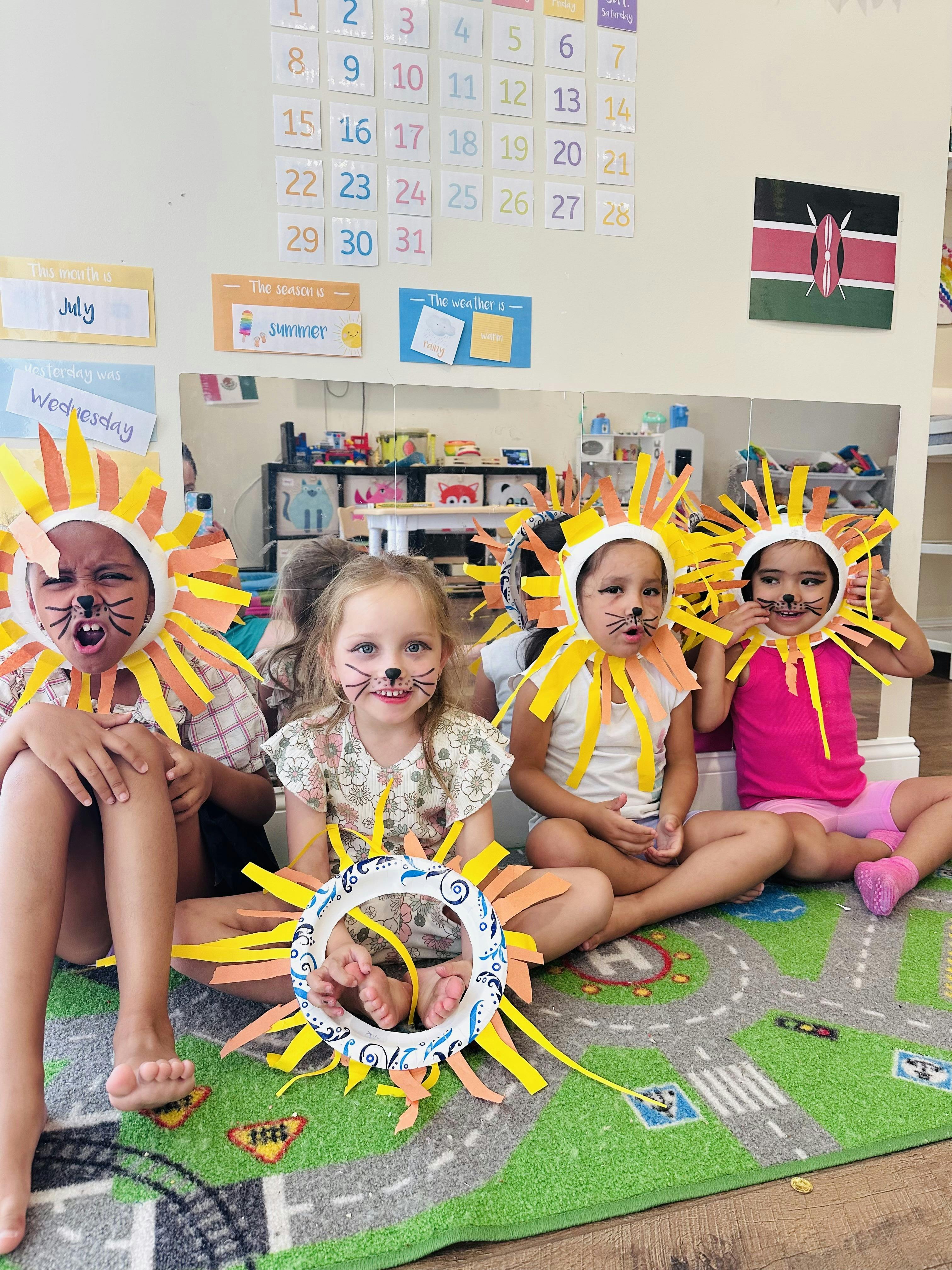Children with painted faces wearing lion mane crafts