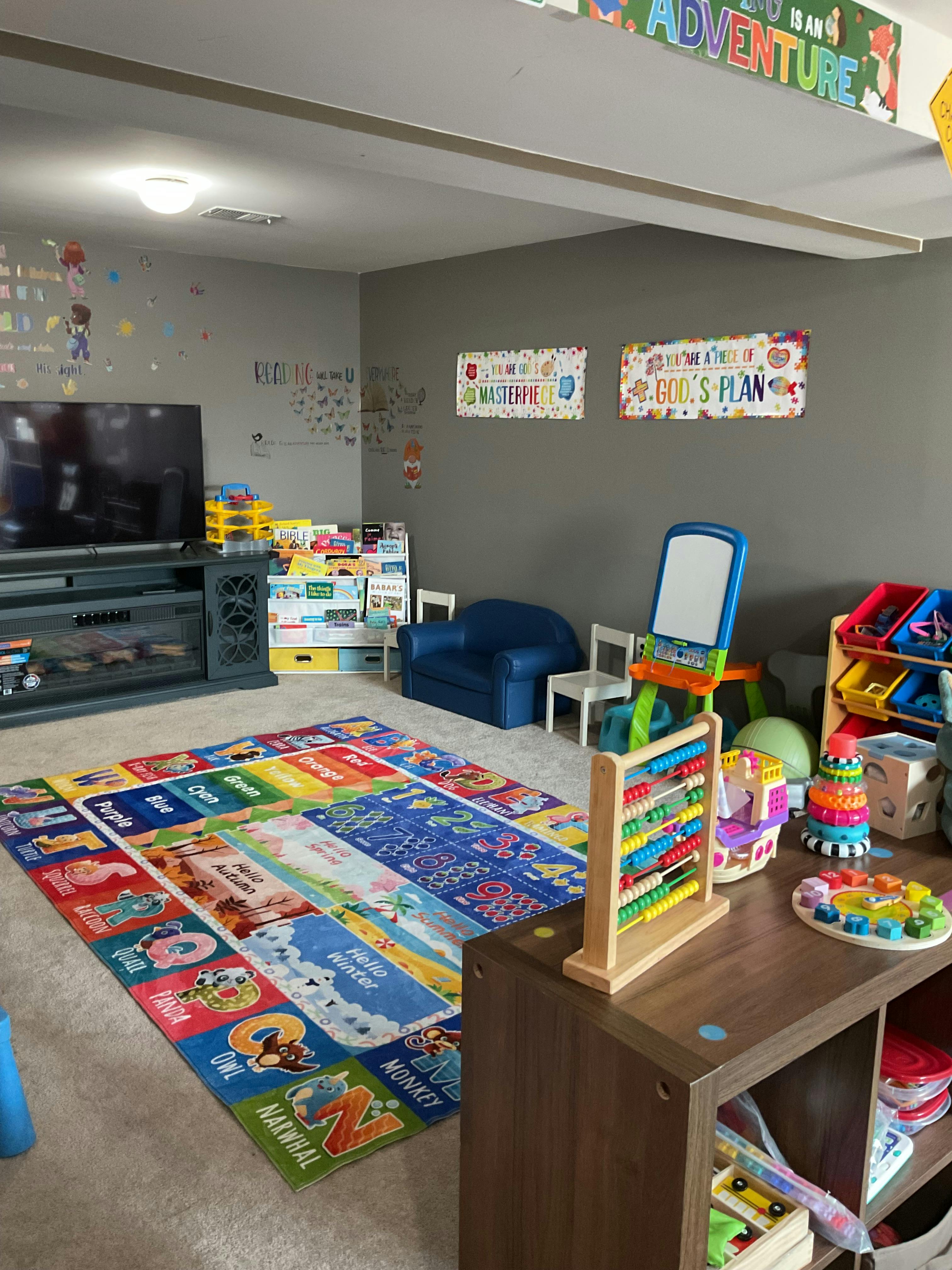 Colorful educational playroom with alphabet rug and children's toys