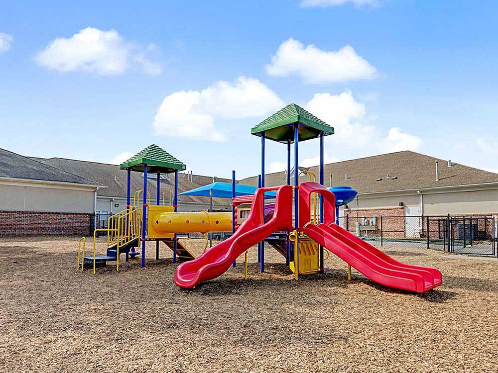A colorful playground with slides and climbing structures