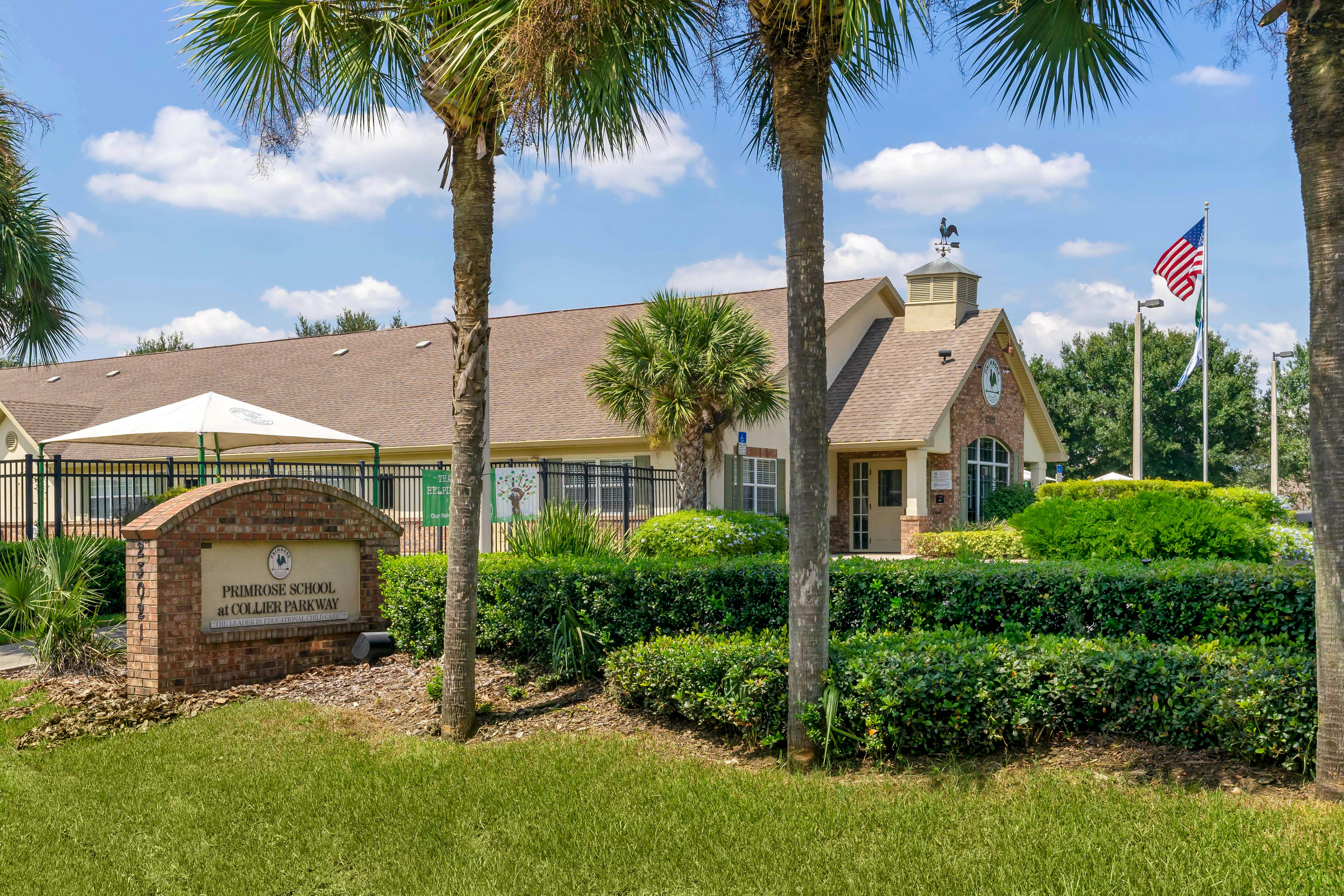 Primrose School at Collier Parkway sign in front of a building