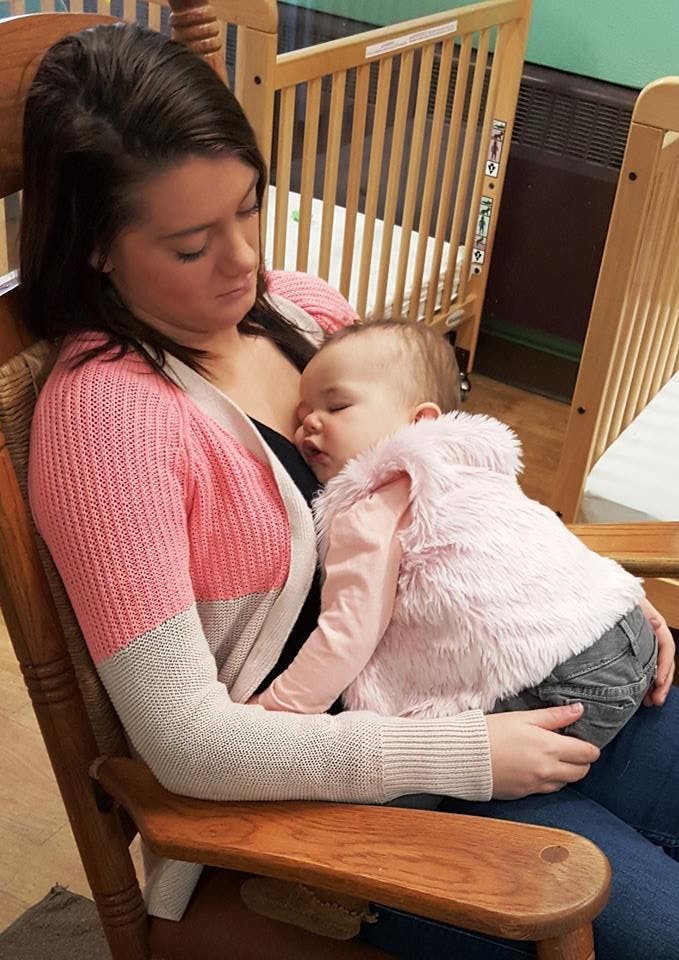 Person holding a sleeping child