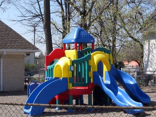 Playground structure with multiple slides