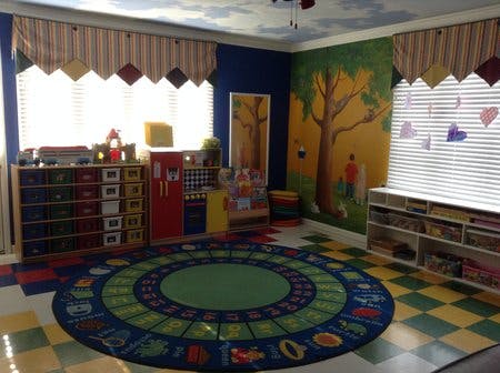 Colorful classroom with a large circular rug and storage units