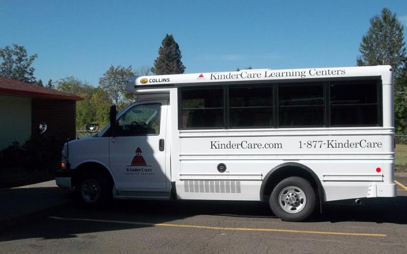 White KinderCare Learning Centers shuttle bus