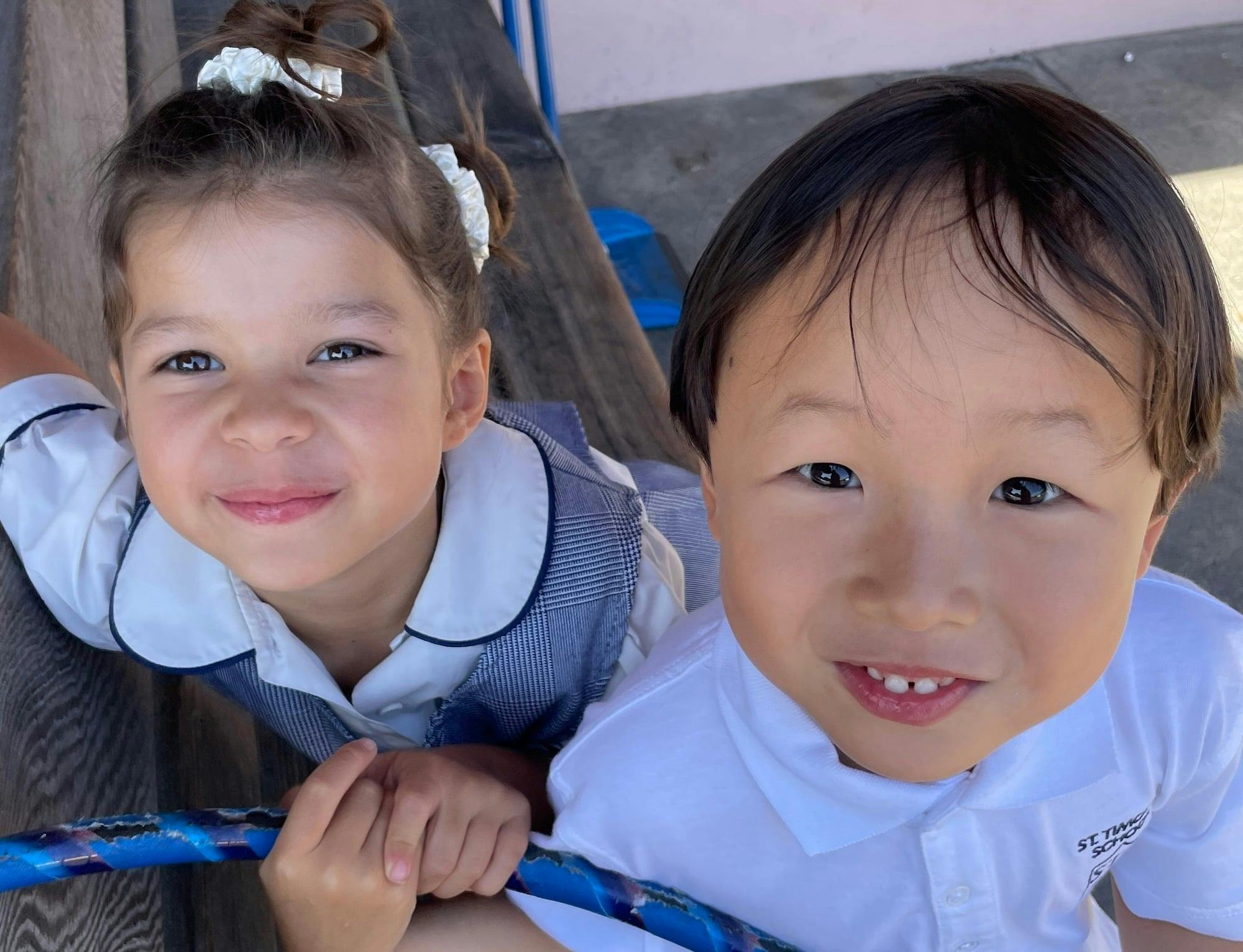 Two children looking up at the camera