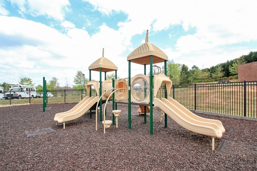 Playground with slides and climbing structures