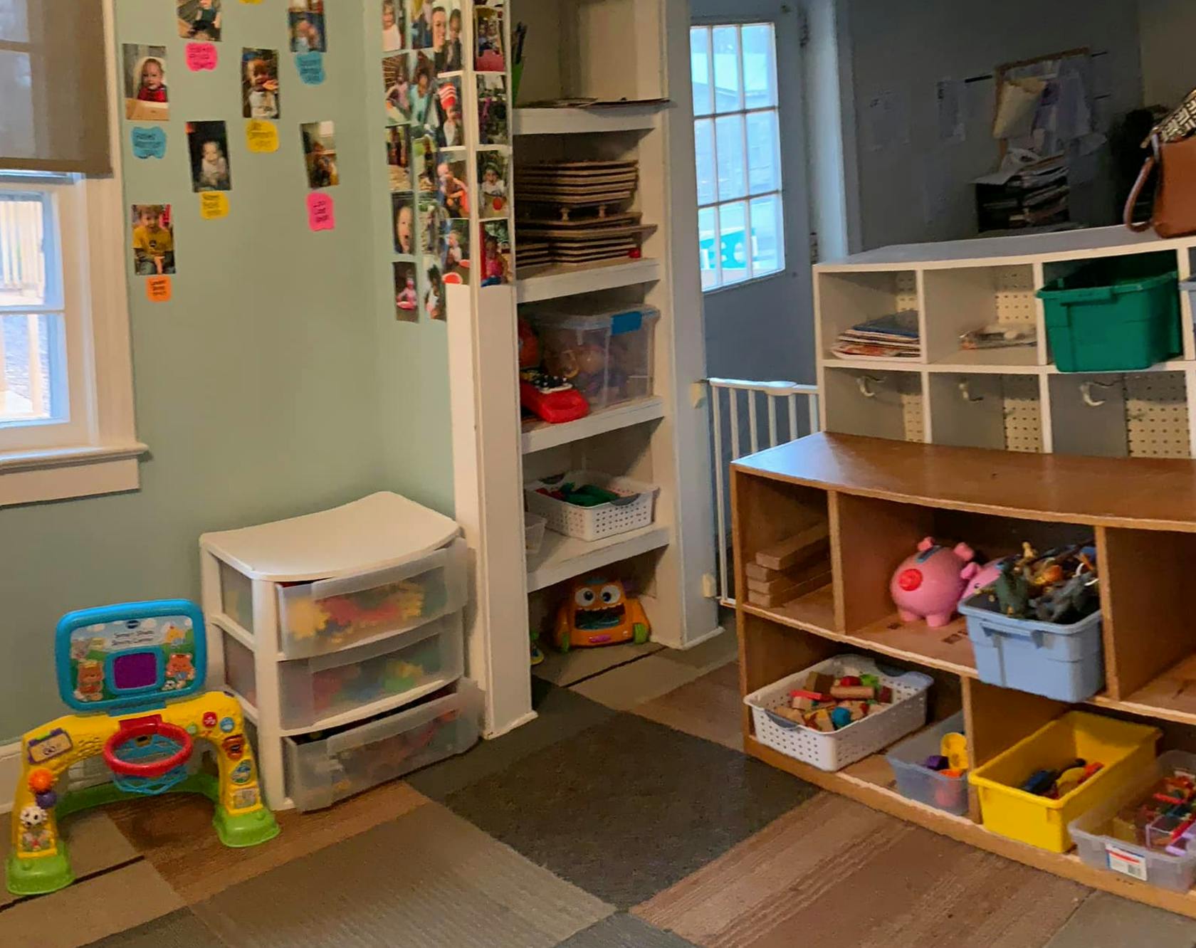 Room with shelves, storage bins, and child's play arch