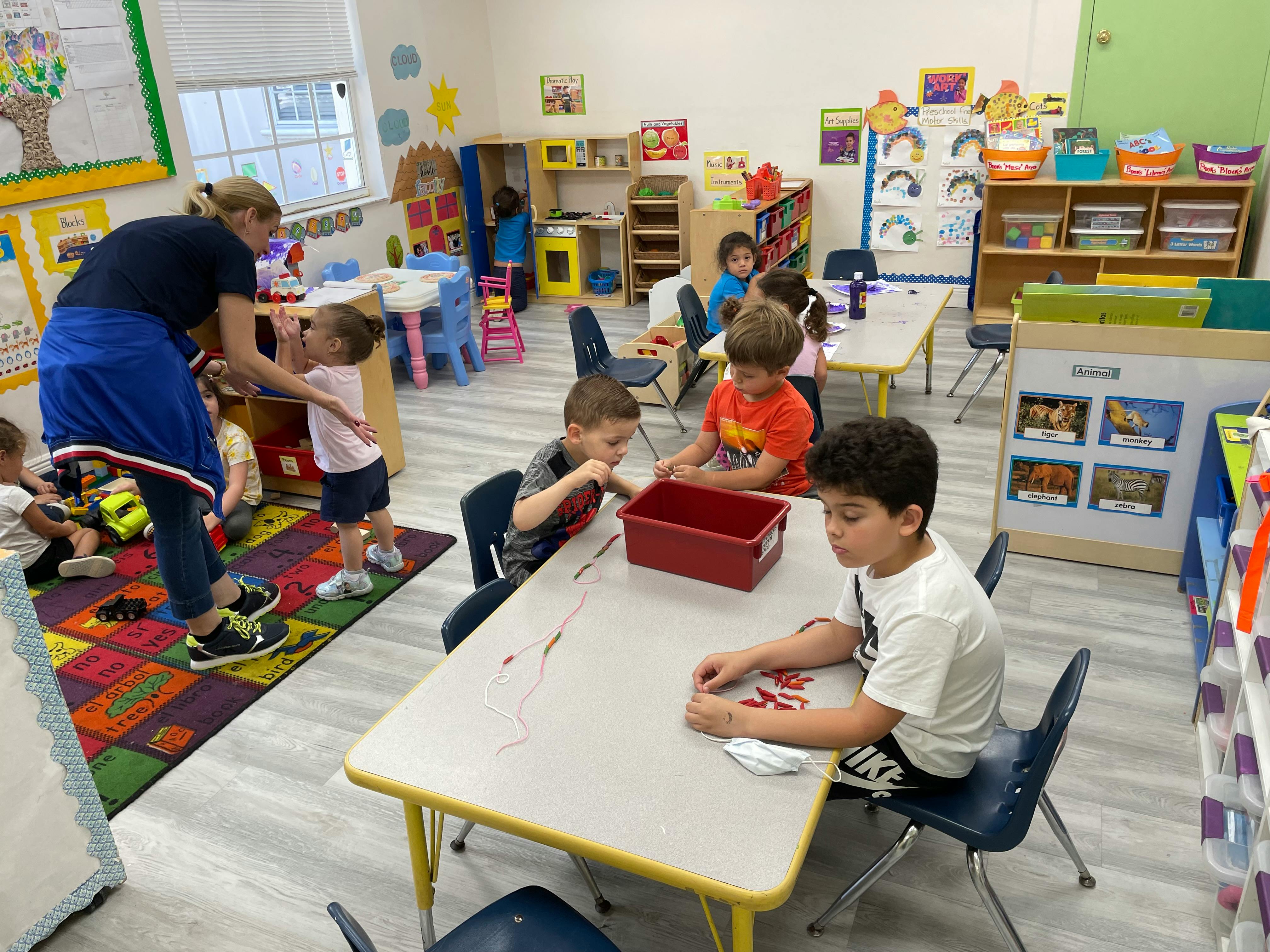 Adult and children in a classroom