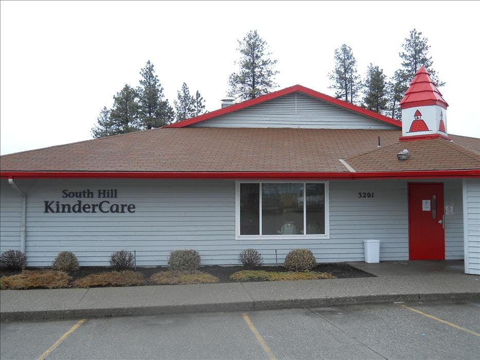 South Hill KinderCare building exterior with red trim and cupola