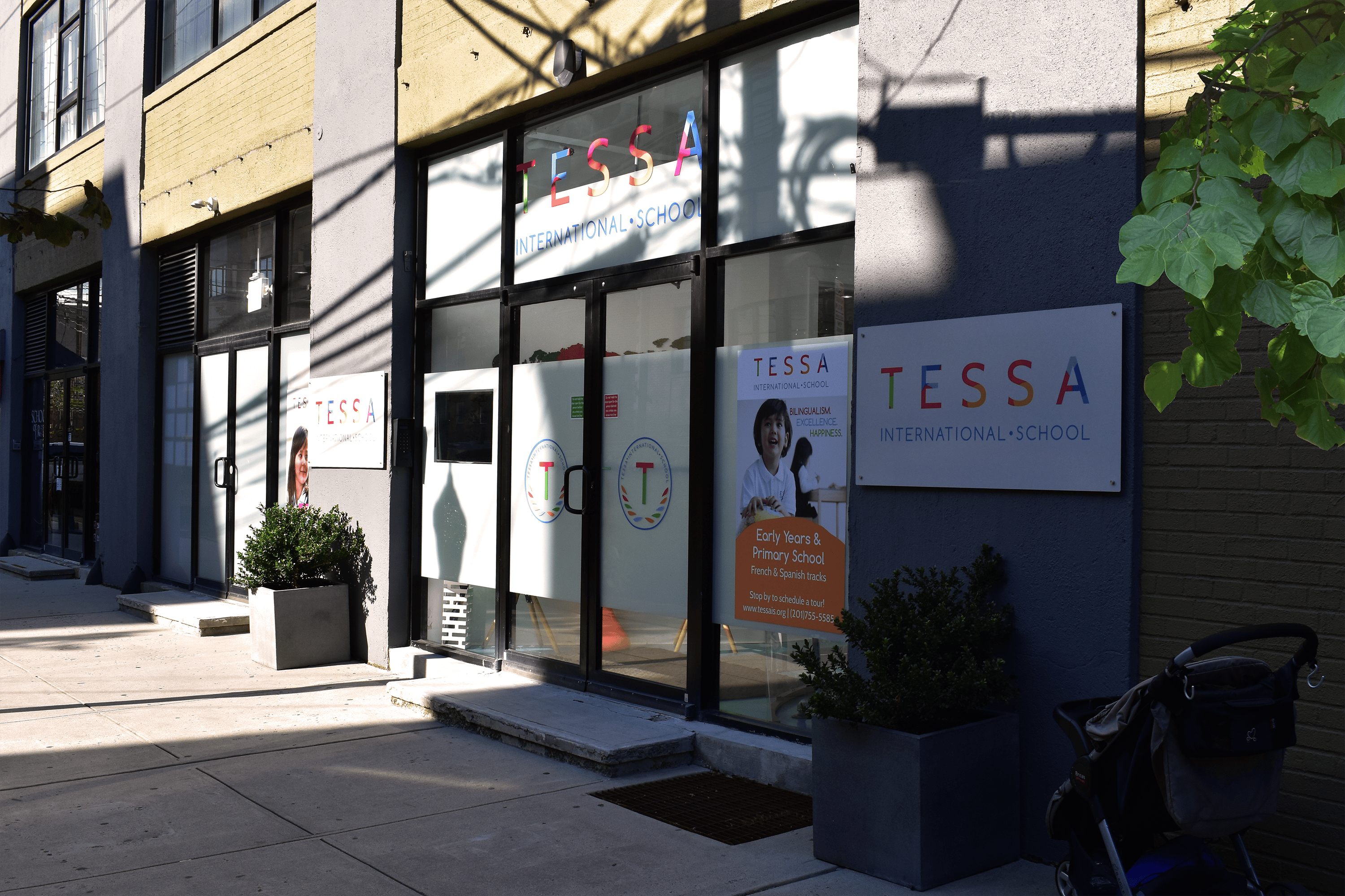 Building exterior with a sign that reads "TESSA"