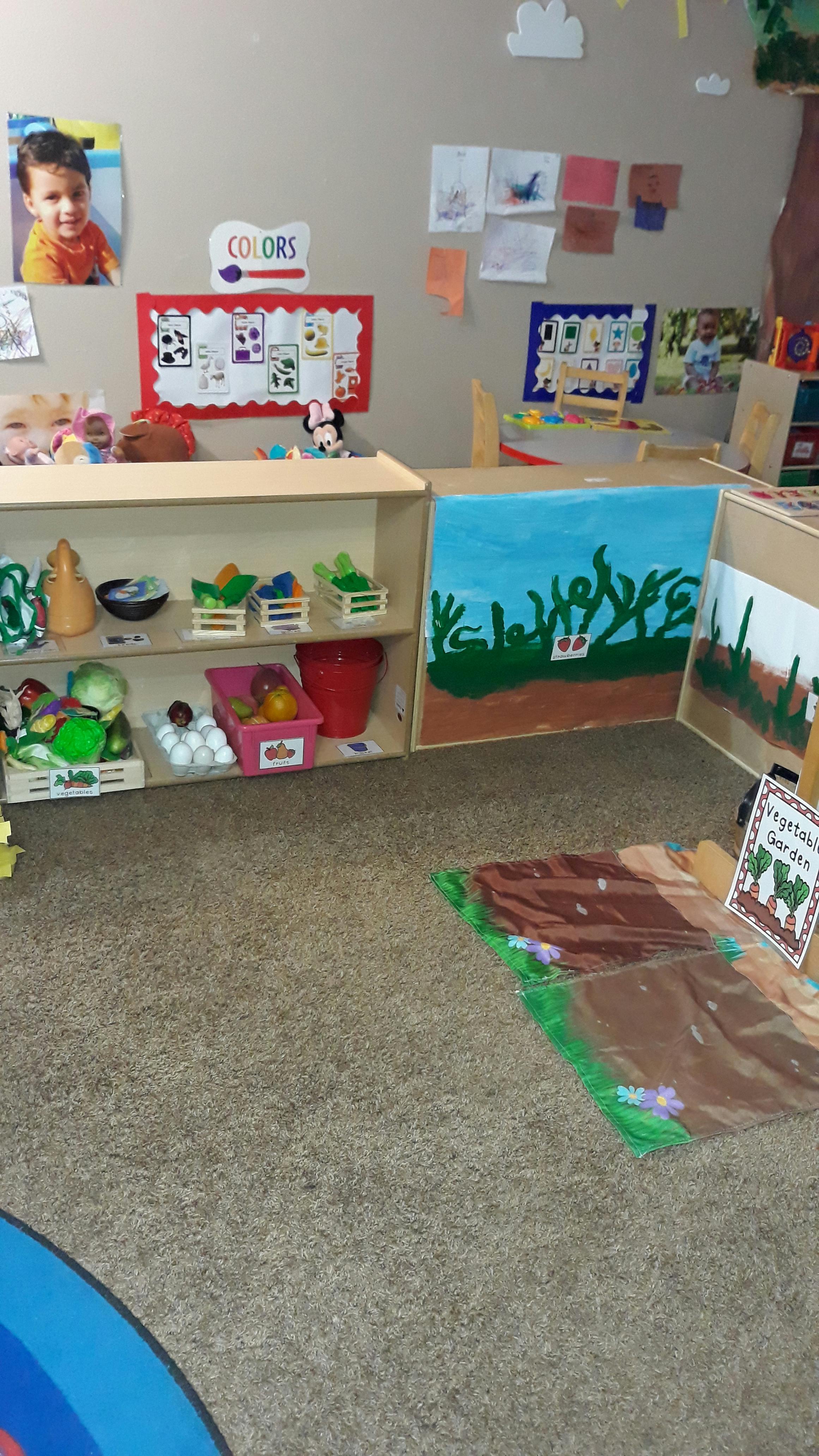 Classroom with shelves of toys and art on the walls