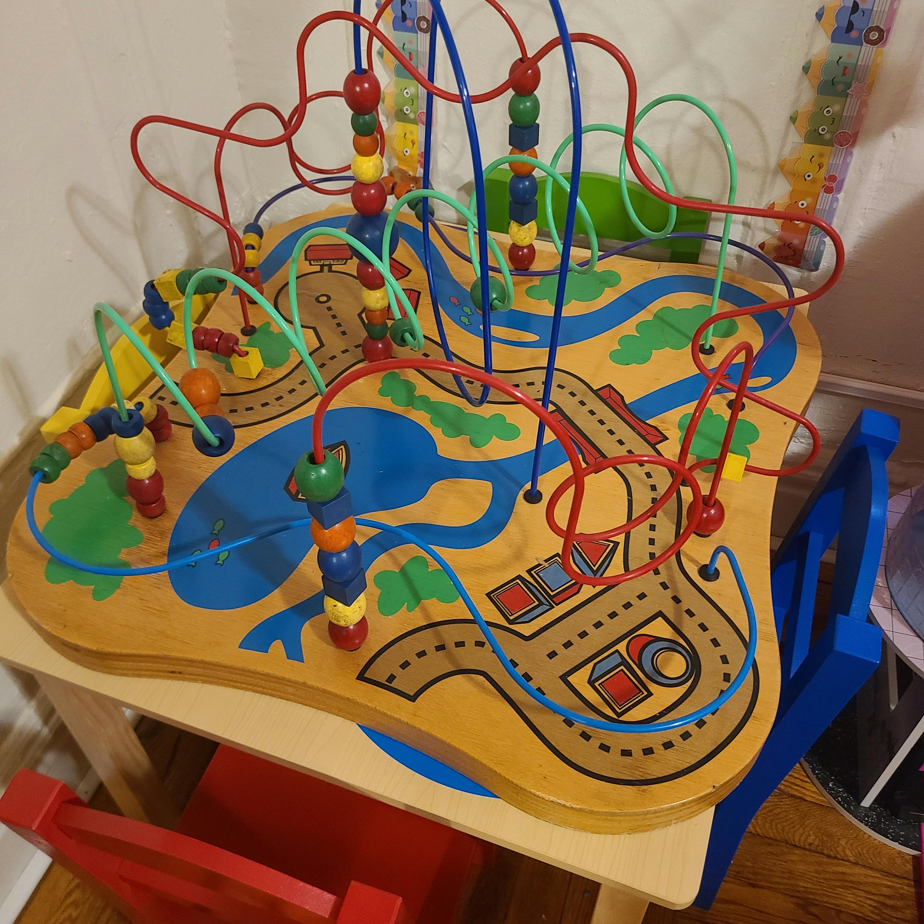 Wooden activity table with bead maze and painted roads