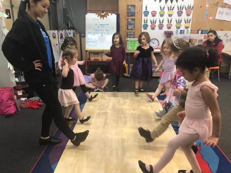 Adult and children in a dance class