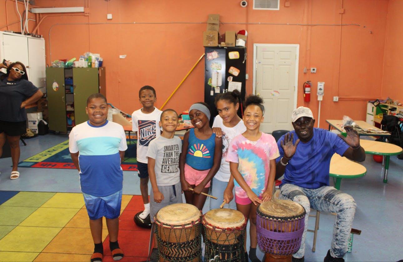 Group of children and adults with drums