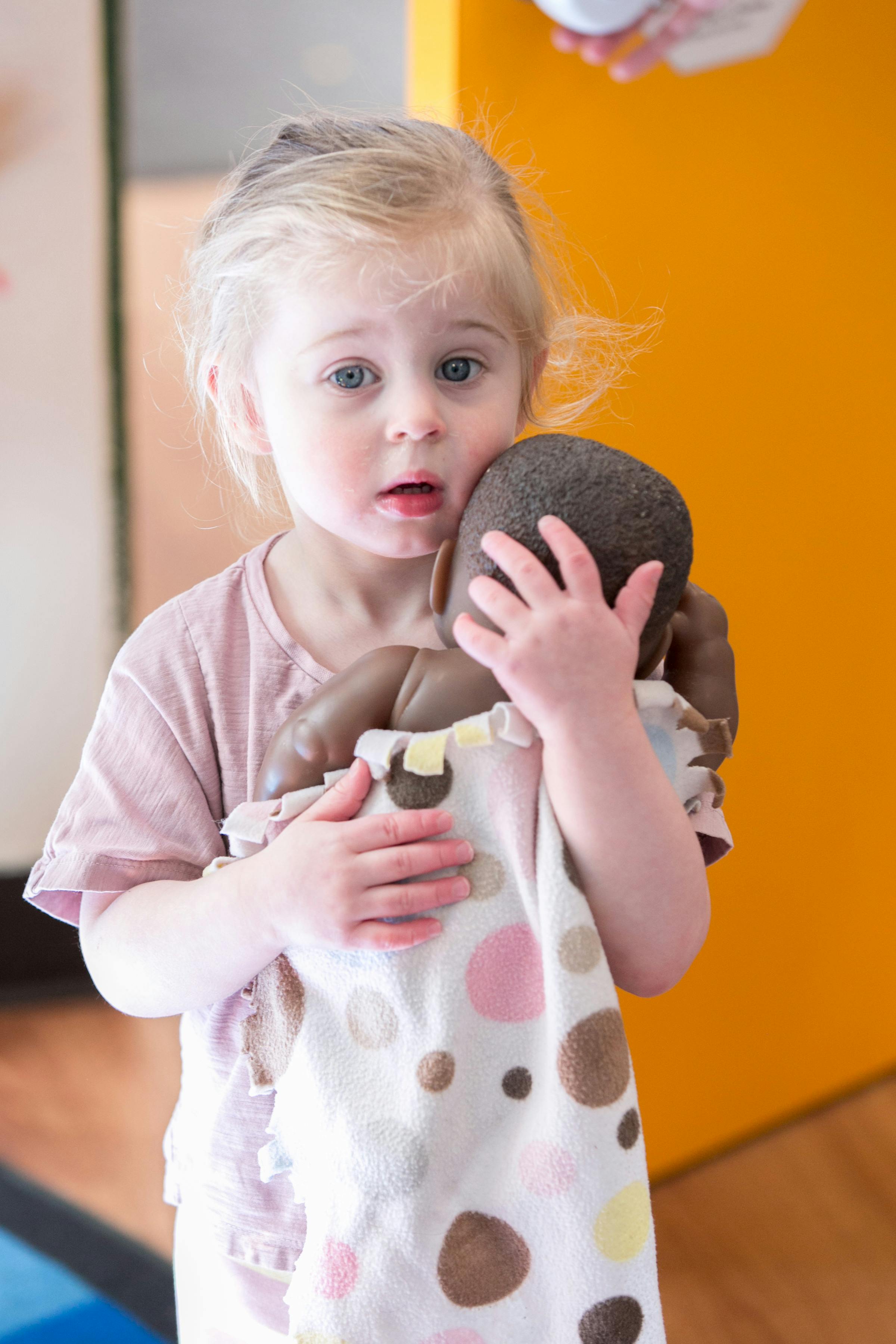 Child holding a doll