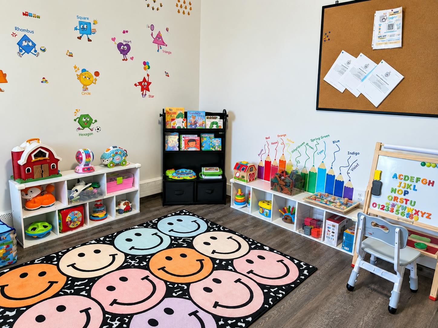 Playroom with alphabet board, shelving units filled with toys, and smiley rug