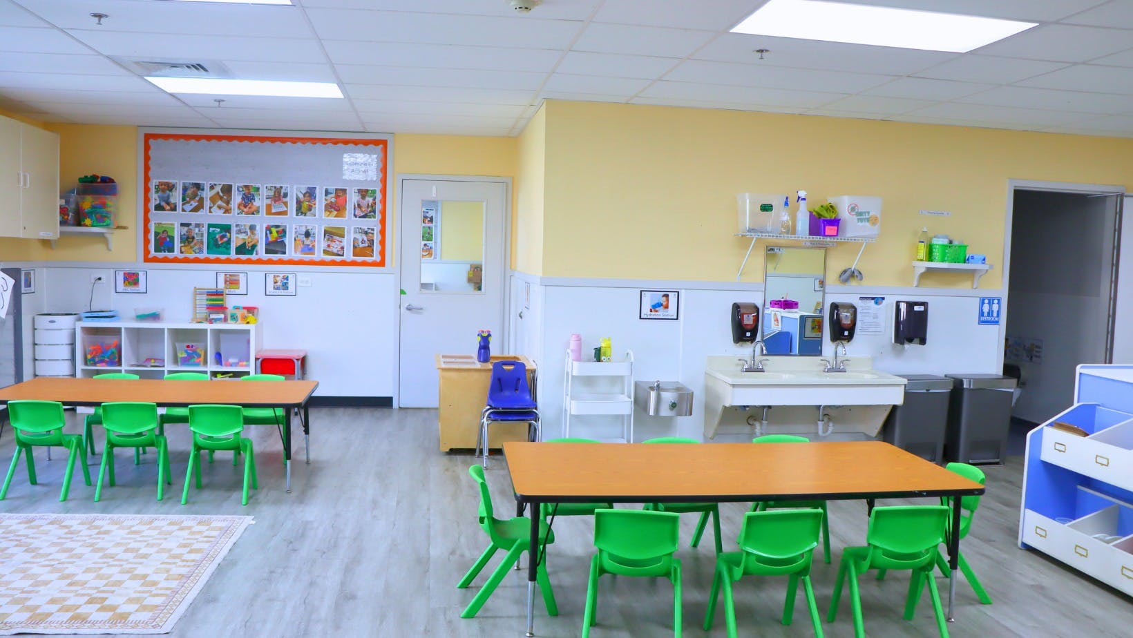 Empty classroom with small tables and chairs