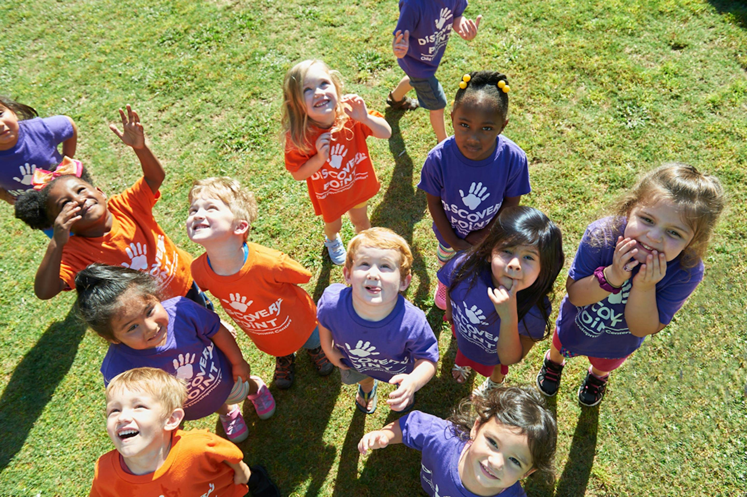 Group of children looking up at the camera