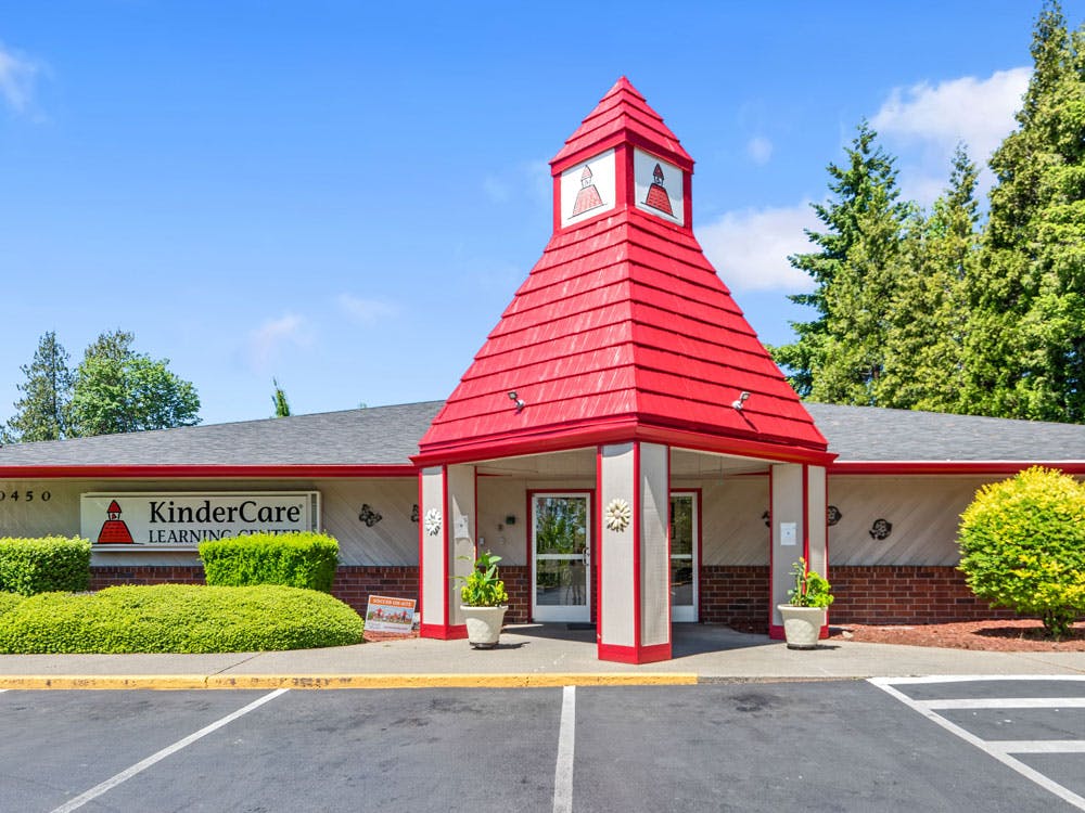 KinderCare Learning Center building with red steeple