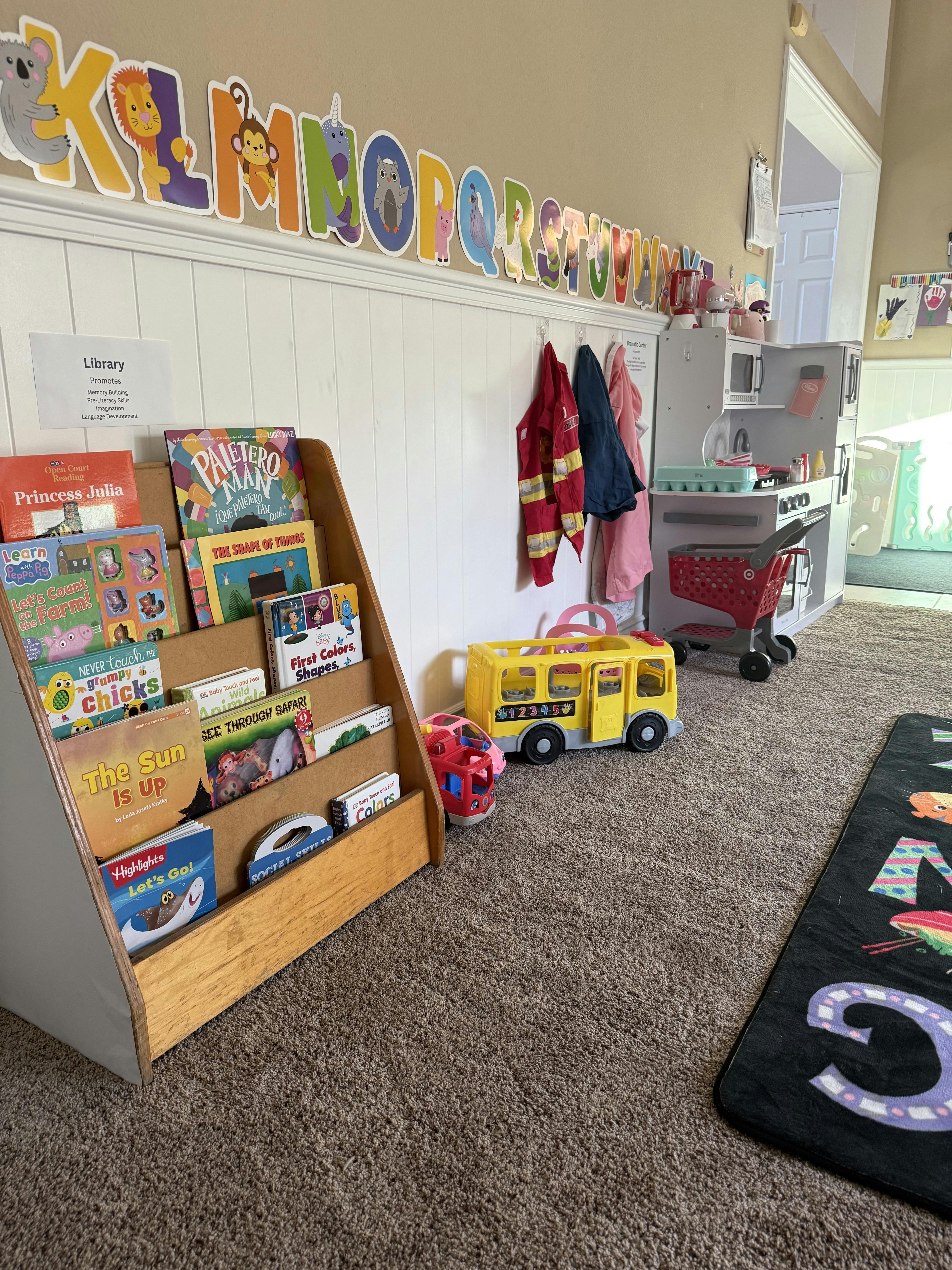Wooden bookshelf for children filled with books in a classroom setting