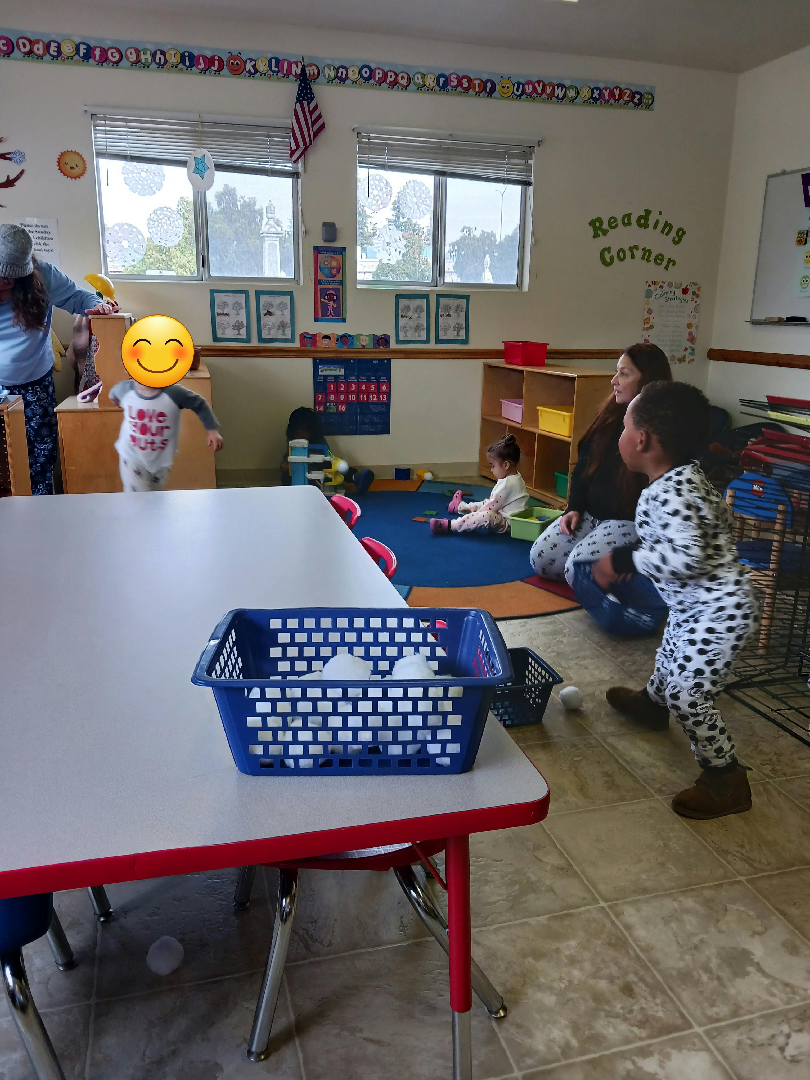 Adults and children in a classroom