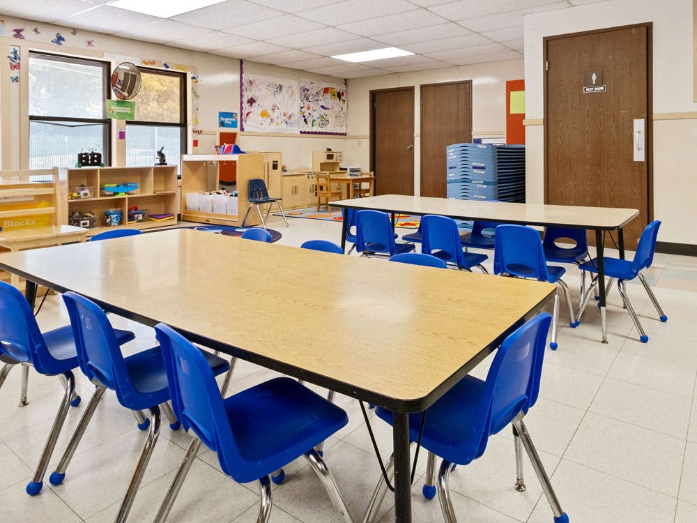 Classroom with child-sized tables and chairs