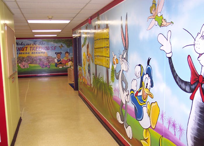Hallway with cartoon murals on the walls