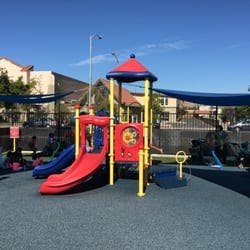 Playground with red and blue slides