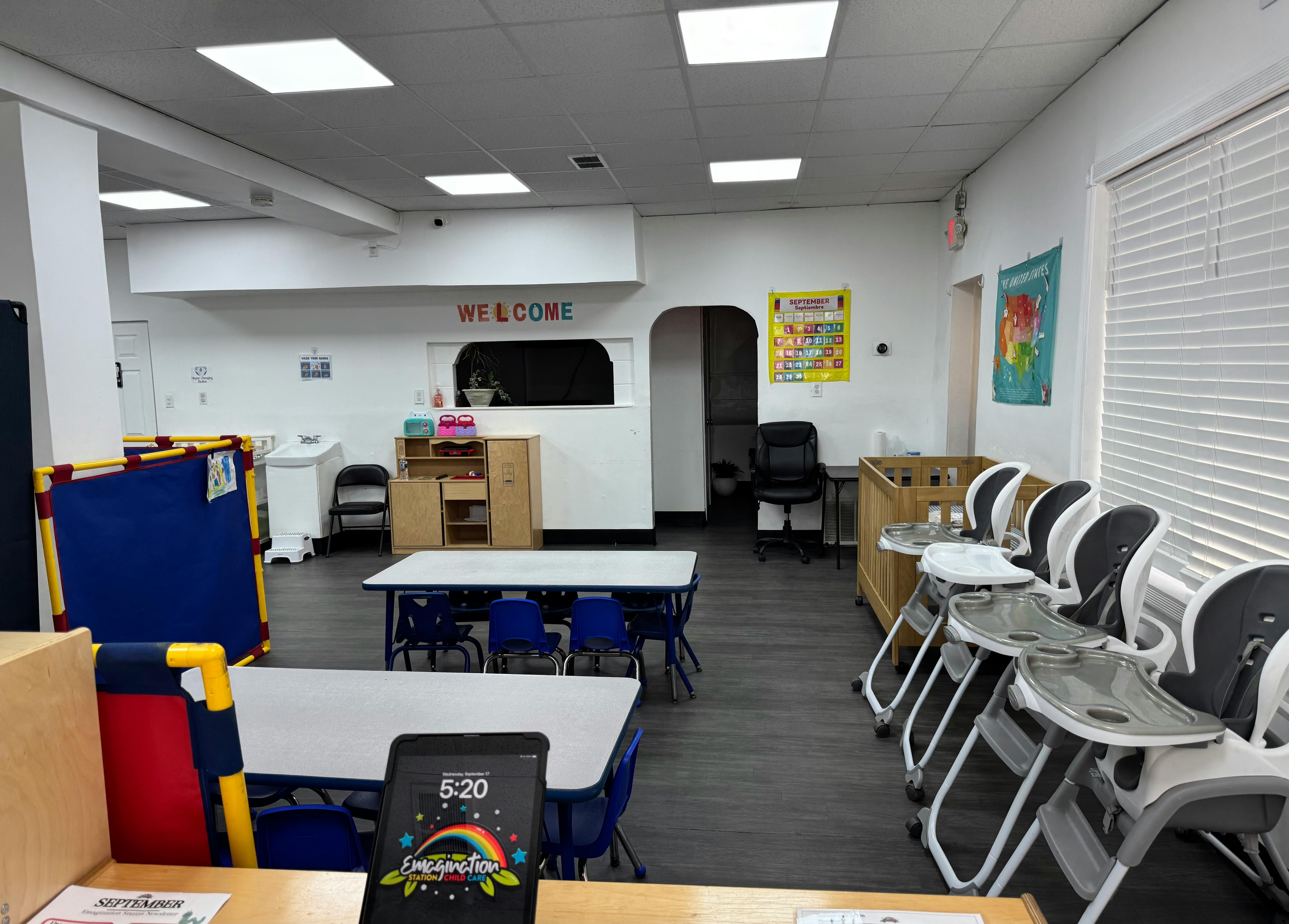 Classroom with tables, chairs, and high chairs