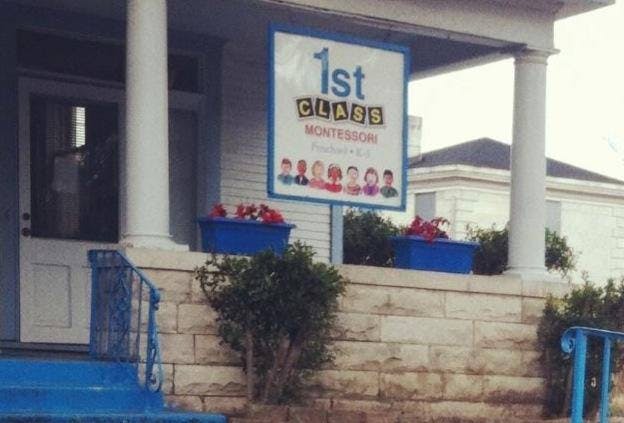 Sign for 1st Class Montessori on a building porch