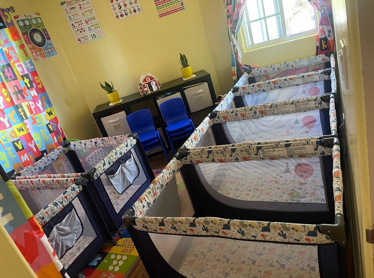 Multiple portable cribs in a room