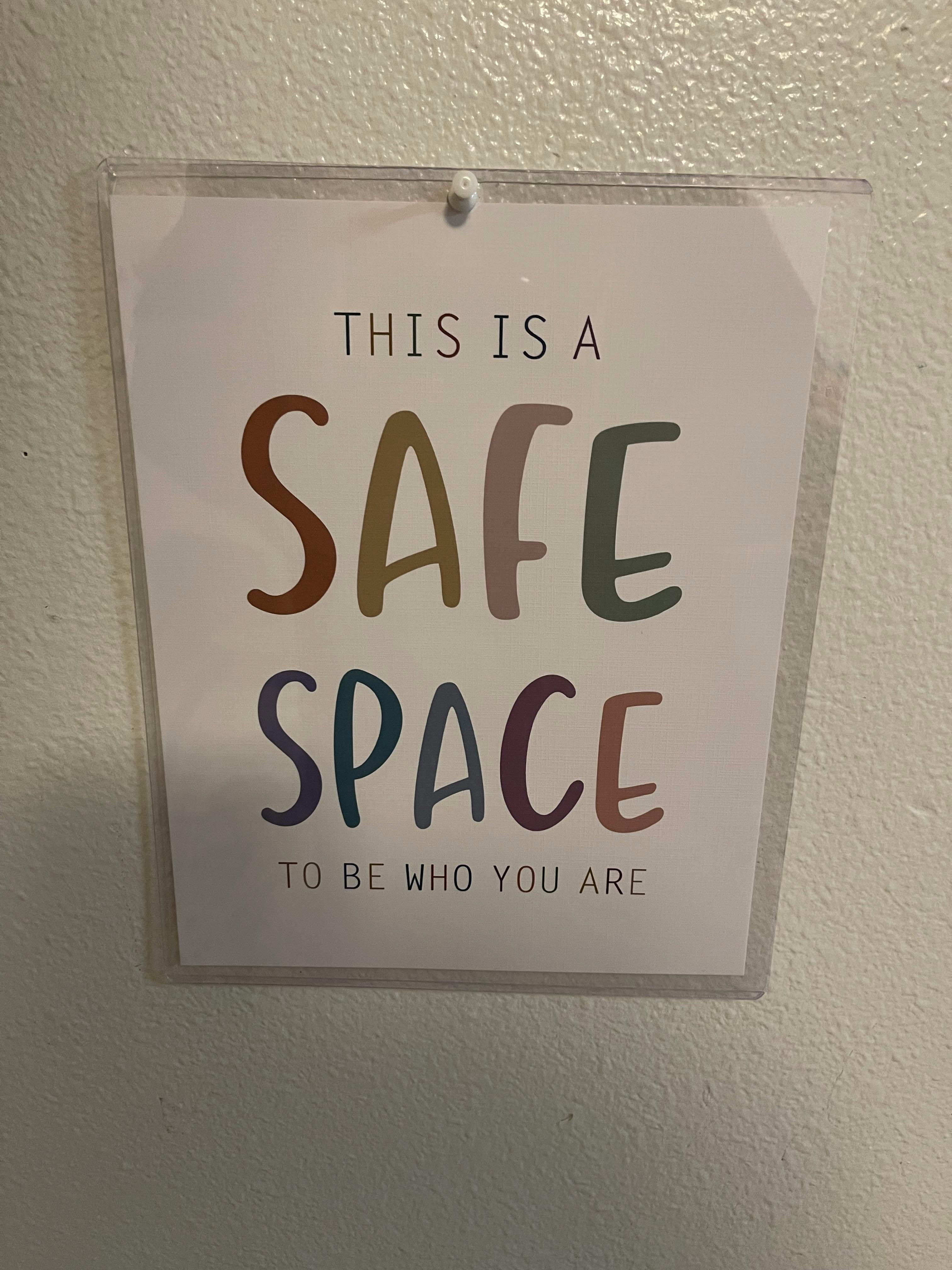 Sign that reads "This is a safe space to be who you are"