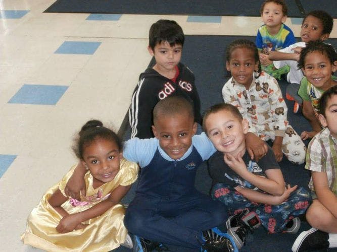 Group of children sitting on the floor