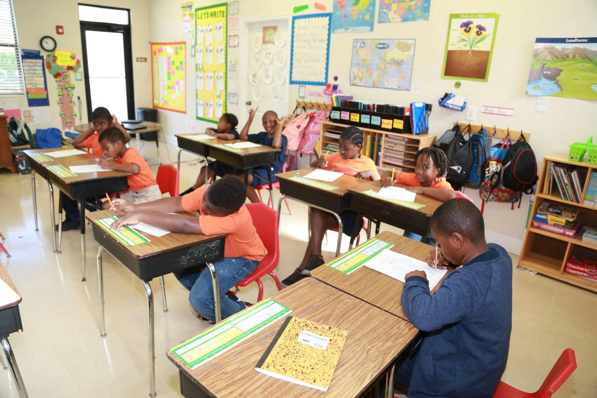 Children sitting at desks in a classroom
