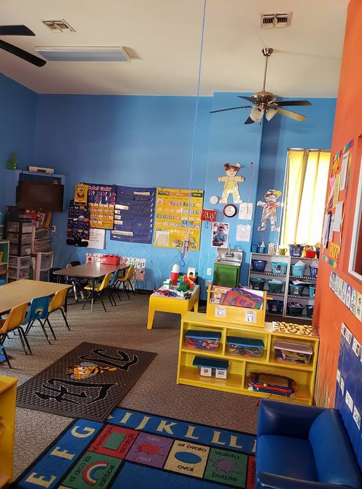 Classroom with tables, chairs, and learning materials