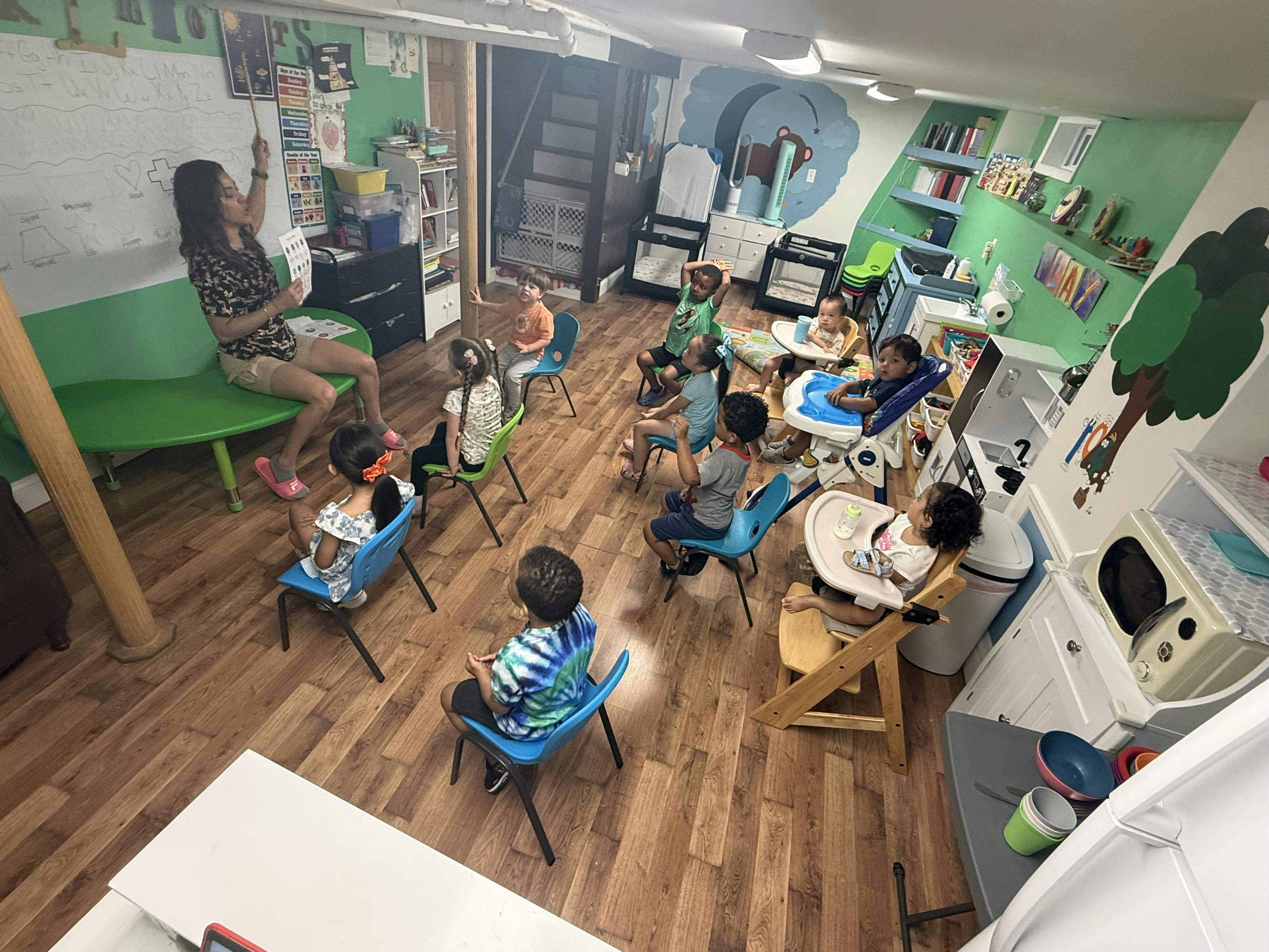 A person teaching a group of children in a classroom