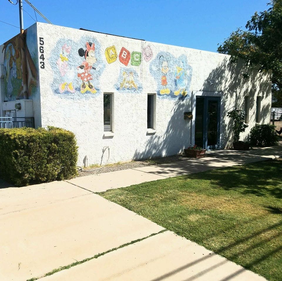 Building with a mural of cartoon characters and ABCs