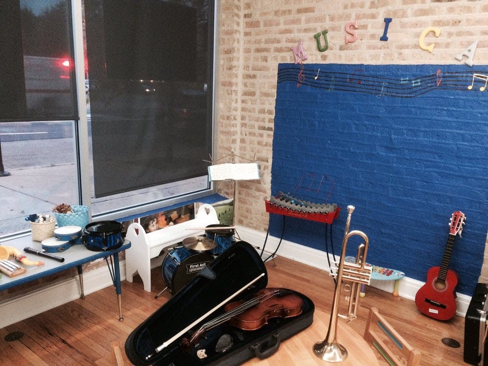 Music room with a violin, trumpet, guitar, and keyboard
