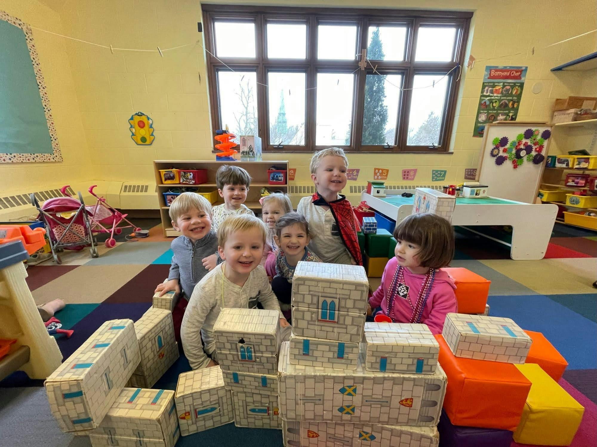 Children playing with blocks in a classroom