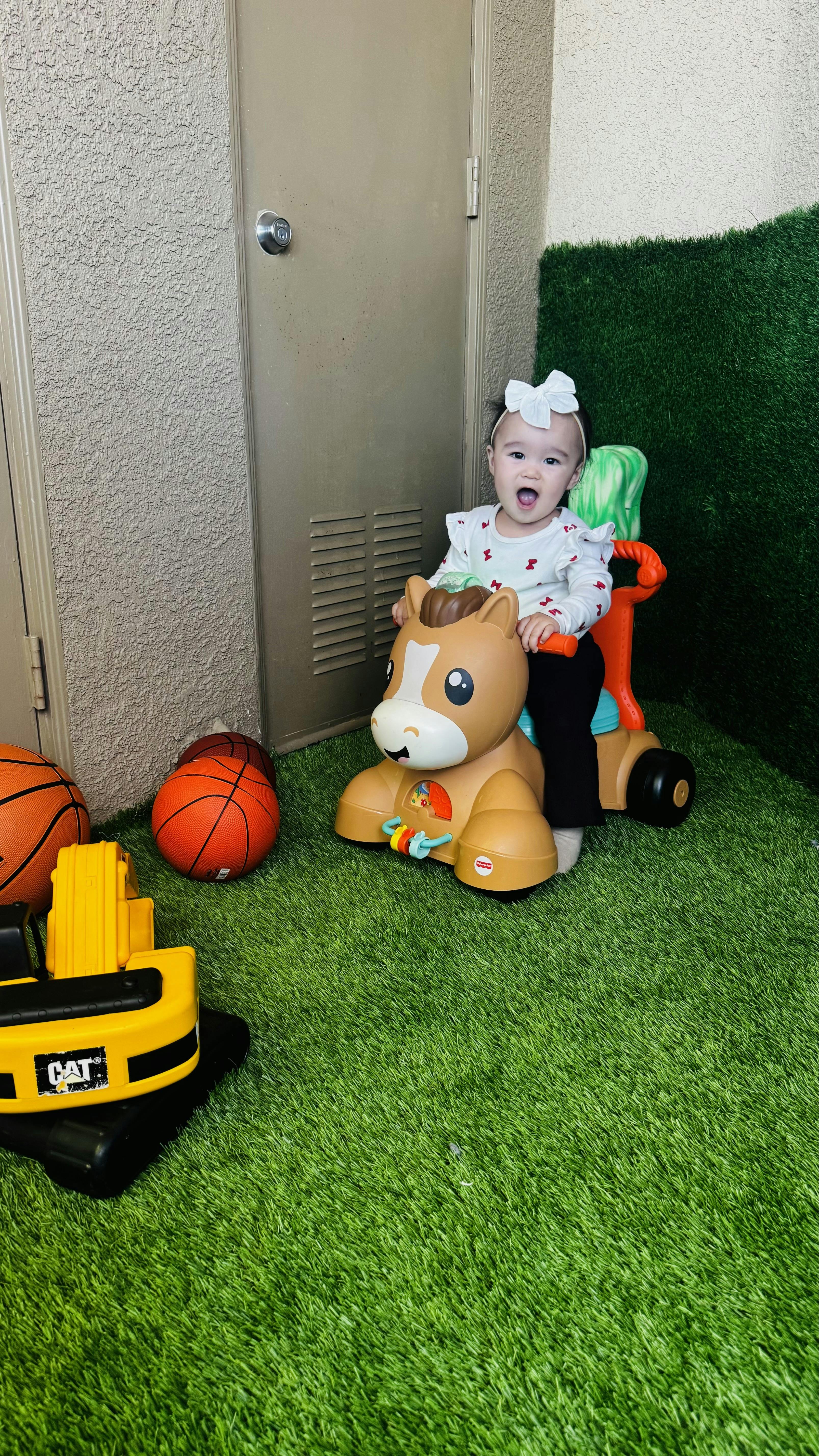 Child riding a toy horse