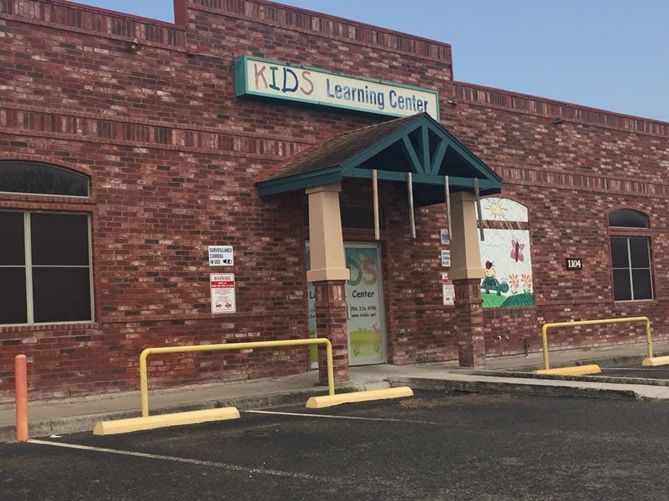 Brick building with a sign that reads "KIDS Learning Center"